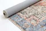 Roll of patterned rug with a neutral color on a white background