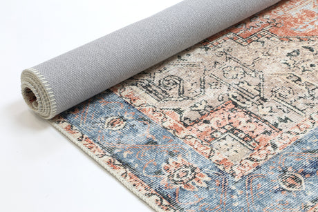 Roll of patterned rug with a neutral color on a white background