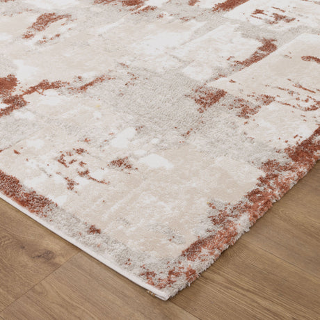 White and red patterned rug on a wooden floor